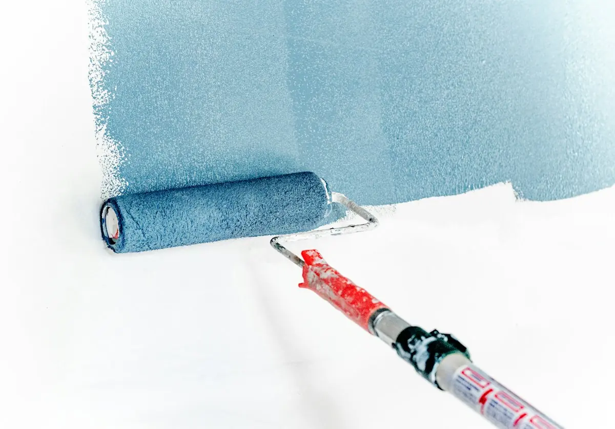 Painter working on the exterior of a house