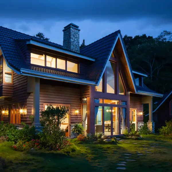 Craftsman home exterior lit up at dusk