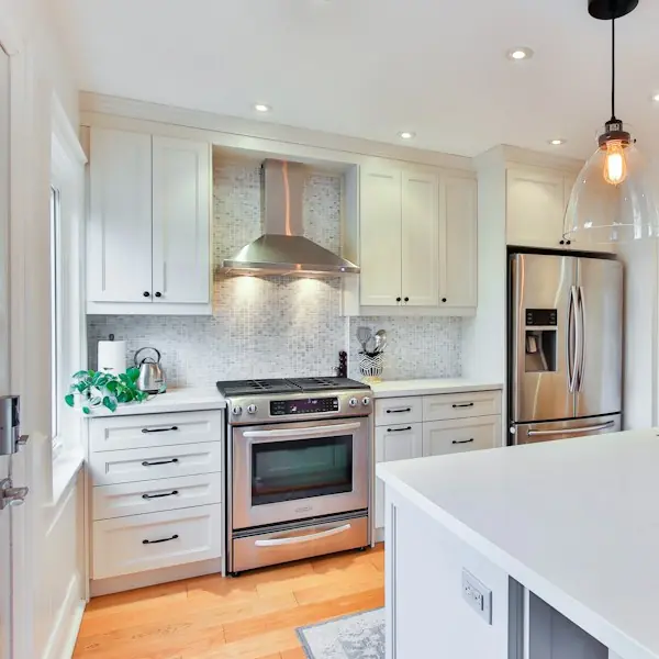 Finished white kitchen with stainless range and island