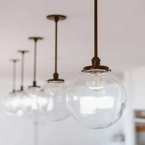 Row of glass globe pendant lights