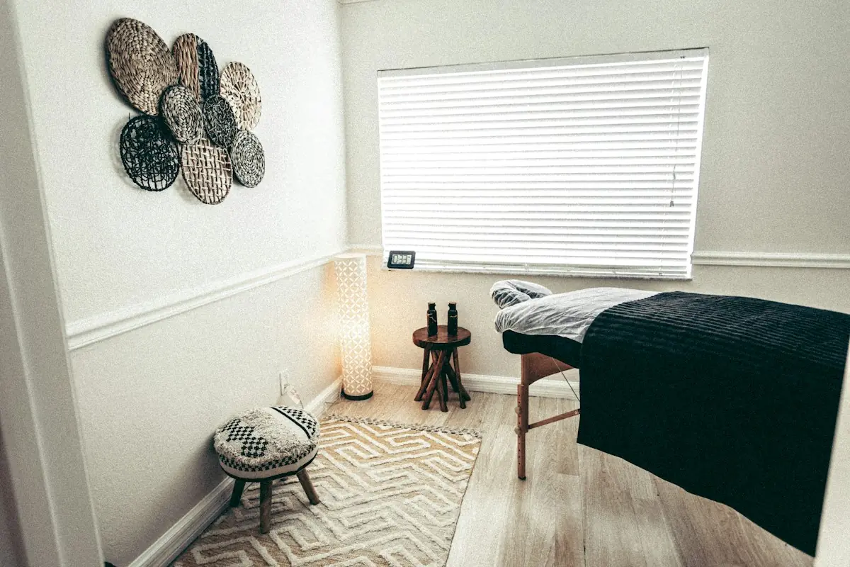Calm spa treatment room with a dressed table