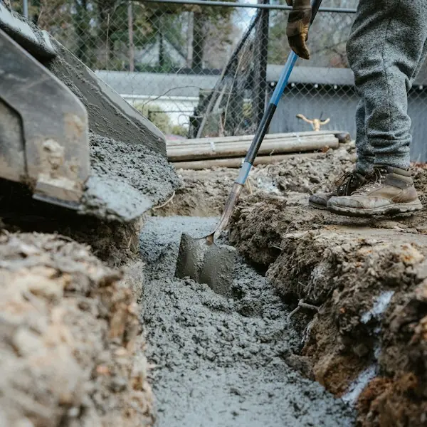 Concrete being poured into a foundation footing