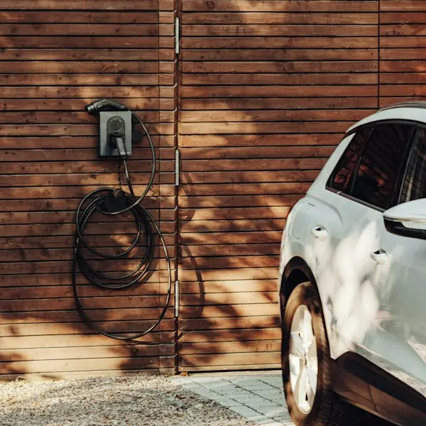 Home EV charger mounted on a garage wall